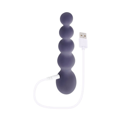 Purple silicone beaded anal vibrator with USB charging cable on white background.