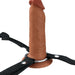 Brown 6-inch hollow silicone strap-on with black adjustable nylon harness and metal ring base.