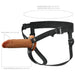 Brown 6-inch hollow silicone strap-on with adjustable black nylon harness for waist sizes 24 to 53 inches.