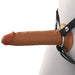 Brown hollow silicone strap-on with black adjustable nylon harness on mannequin side view.