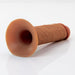 Hollow silicone strap-on dildo in natural skin tone with flared base on white background.