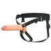 7-inch realistic flesh-tone silicone strap-on with adjustable black nylon harness and metal ring attachments.