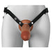 Front view of a realistic brown silicone hollow strap-on with black adjustable nylon harness on a mannequin.