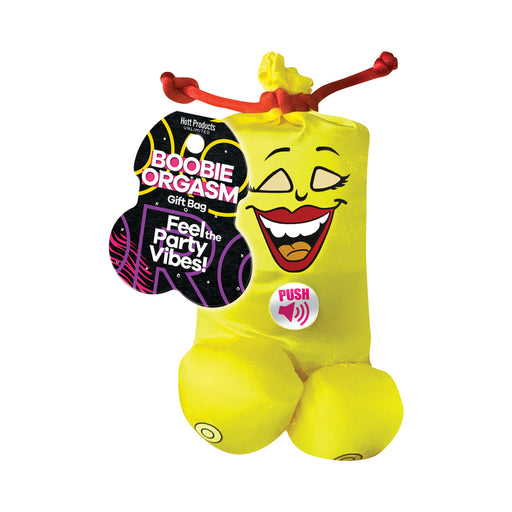 Bright yellow Boobie Orgasm gift bag with a smiling face design and red drawstring, featuring a push button for sound activation.
