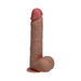 Realistic tan vibrating and thrusting dildo with detailed veins and textured balls on a suction base.