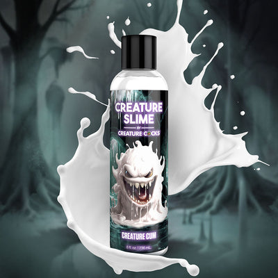 Bottle of Creature Slime unscented lubricant with a monster-themed label and white liquid splash background.