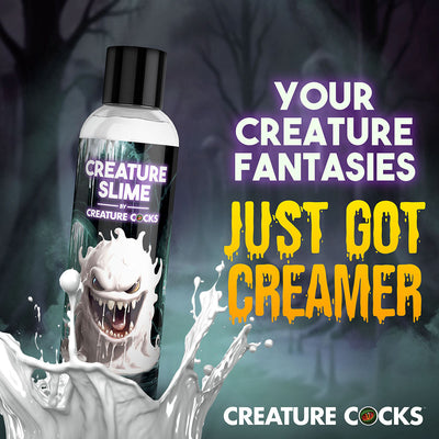Bottle of Creature Slime unscented lubricant with a monster graphic and splash effect against a dark, eerie background.