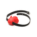Extreme silicone gag with a red mouthguard and adjustable black locking strap on white background.
