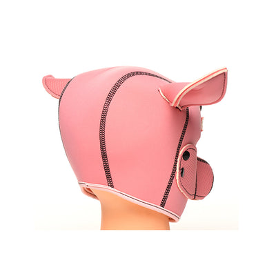 Pink neoprene hood designed with pig ears and snout details on a mannequin head.