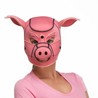 Person wearing a pink neoprene pig hood with ears and snout details, styled for costume or role play.