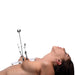 Side view of a woman lying down using the Master Series Tower of Pain adjustable nipple clamps with clear acrylic base.