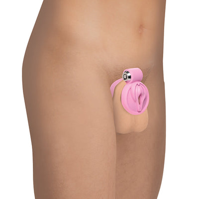 Side view of a person wearing a pink vulva-shaped locking chastity cage designed for secure and comfortable restraint.