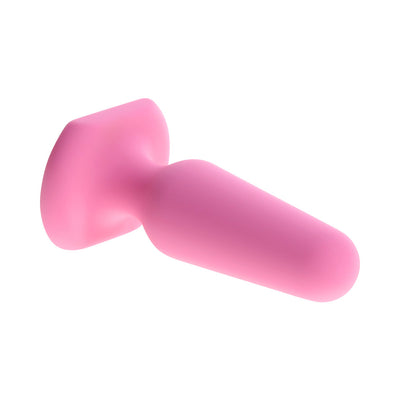 Pink petite silicone plug with rounded tip and flared base, designed for comfort and safety.