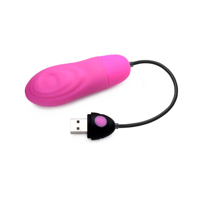 Pink silicone pulsing bullet vibrator with USB rechargeable control and textured surface.