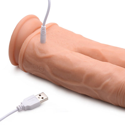 Close-up of a flesh-toned silicone double dildo with USB charging cable connected, showing textured surface and dual shafts.