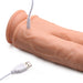 Close-up of a flesh-toned silicone double dildo with USB charging cable connected, showing textured surface and dual shafts.
