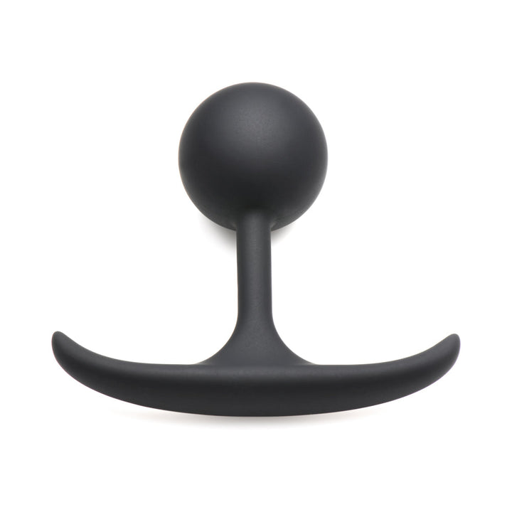 Small black silicone anal plug with a weighted round bulb and slim curved base for comfortable wear.
