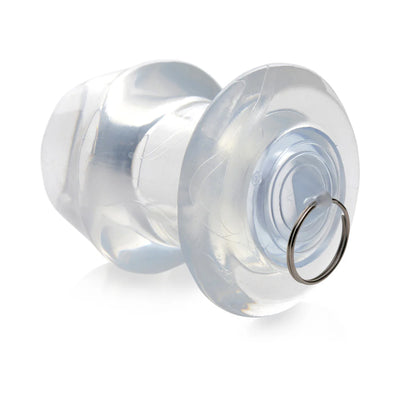 Transparent hollow anal dilator with a removable plug and metal ring, made of firm flexible TPE material.