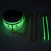 Glowing green collar and leash set with white PU leather and gold chain hardware in low light.