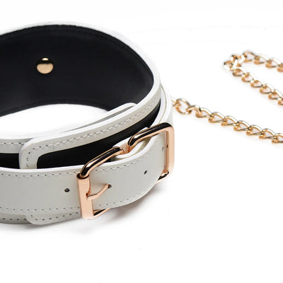 White PU leather collar with gold buckle and matching gold chain leash on a white background.