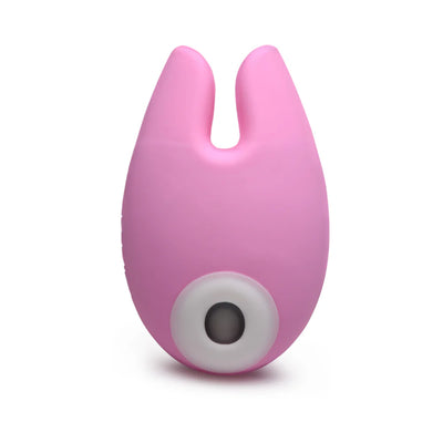Pink silicone clitoral stimulator with dual bunny ear design and white suction opening on front.