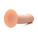 Beige squeezable thick phallic dildo with suction cup base lying on a white surface.