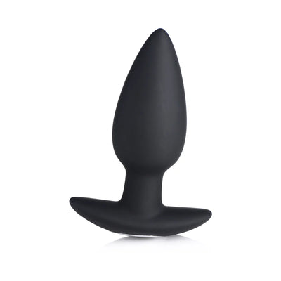 Black silicone tapered vibrating butt plug with wide base for comfortable wear and remote control use.