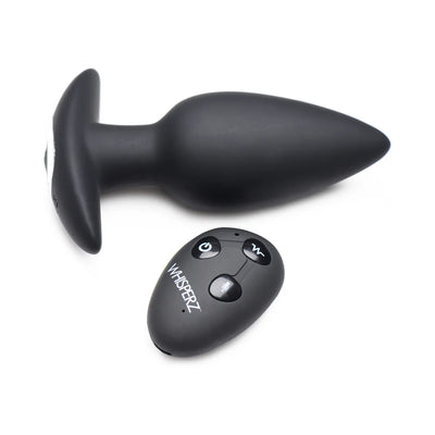 Black silicone vibrating butt plug with tapered tip and wireless remote control featuring power, vibration, and voice activation buttons.