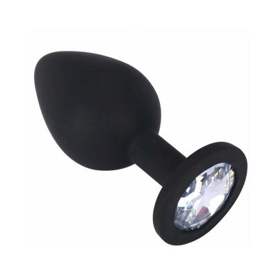 Black silicone butt plug with tapered tip and clear jewel base for elegant training and pleasure.
