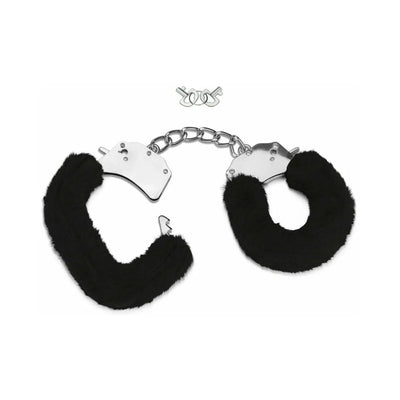Black furry handcuffs with metal chain and two small keys on a white background.