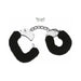 Black furry handcuffs with metal chain and two small keys on a white background.