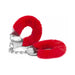 Red furry handcuffs with silver metal chain and locking mechanism on white background.