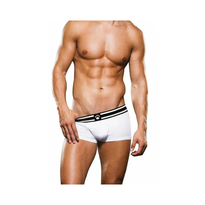Male model wearing white Prowler trunks with black and white waistband featuring paw logo, showcasing fit and style.