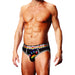 Male model wearing black Prowler briefs with rainbow paw print and matching rainbow waistband.