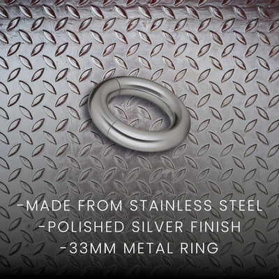 Polished silver stainless steel magnetic ring with 33mm diameter on textured metal background.