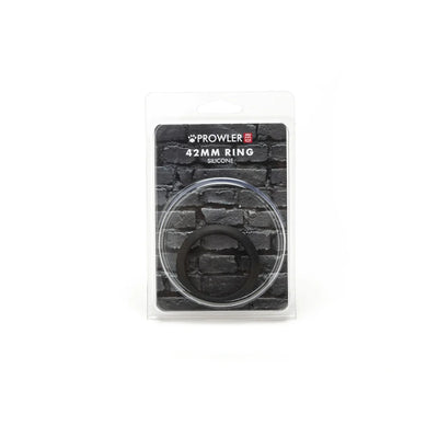 Black silicone ring in clear plastic packaging with a brick wall background and product branding.
