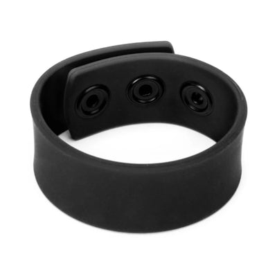 Black silicone adjustable strap with three snap closures, designed for intimate use.