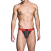 Male model wearing a red and black Prowler ass-less jockstrap with a paw print logo on the waistband.