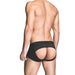 Rear view of a male model wearing black Prowler ass-less trunks with an open back design.