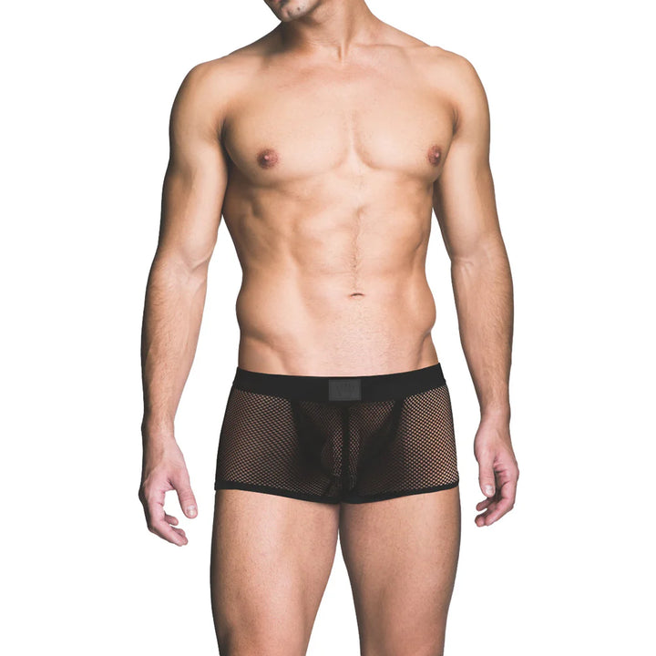 Male model wearing black fishnet trunk underwear with a solid waistband, showcasing a bold and breathable design.