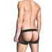 Back view of a man wearing black fishnet assless trunks with a solid waistband and red accents.