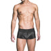 Male model wearing black wetlook assless trunk underwear with a smooth, shiny finish and wide waistband.