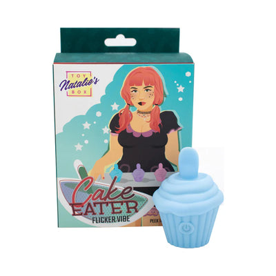 Light blue silicone cupcake-shaped flicker stimulator with packaging featuring illustrated woman and product name Cake Eater Flicker Vibe.