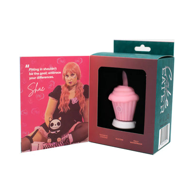 Pink silicone cupcake-shaped flicker stimulator in packaging with a colorful card featuring a woman and inspirational quote.