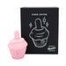 Pink silicone cupcake-shaped flicker stimulator with a soft tongue, displayed next to its black packaging box.
