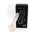 Confetti-filled silicone dildo with suction base displayed next to black packaging box with product illustration.