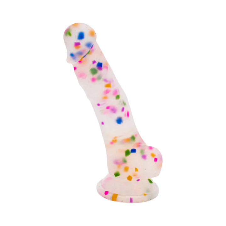 Clear silicone dildo with colorful confetti pieces and a suction cup base for hands-free use.