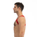 Man wearing a red Prowler sports harness shown from the side on a white background.