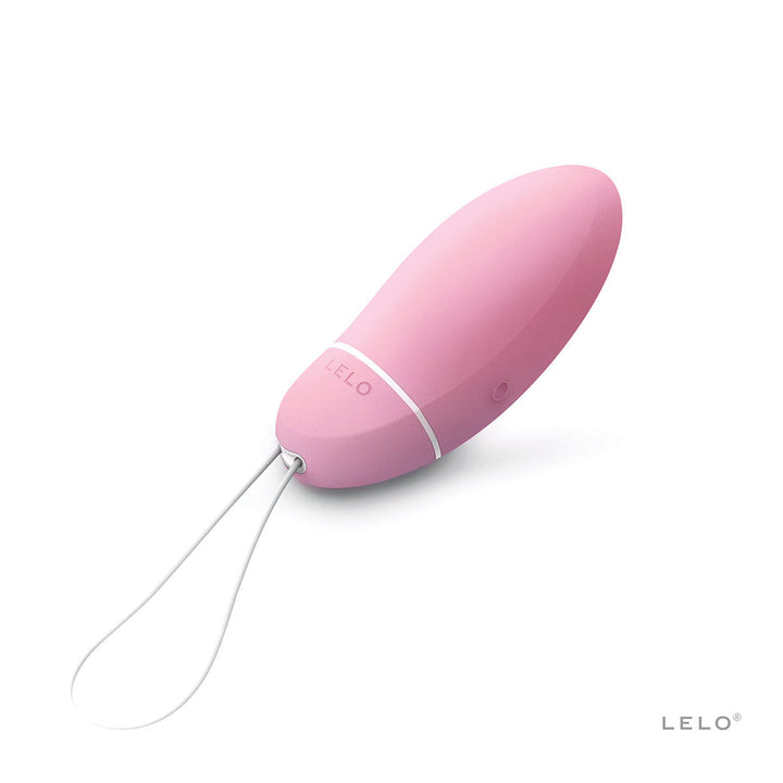 Pink LELO Smart Bead with smooth silicone surface and white retrieval loop on a white background