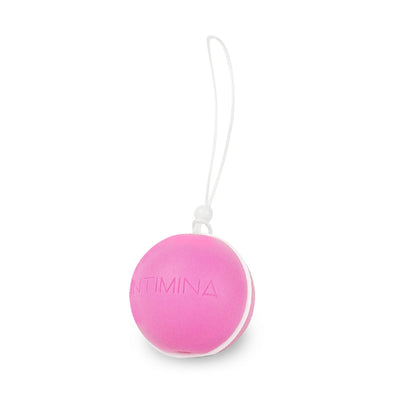 Pink Intimina Laselle Medium 38g weighted pelvic floor exercise ball with white retrieval cord on white background